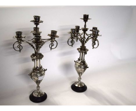 A pair of European five light silver plated candelabra with cherub decoration. - 42 cm high