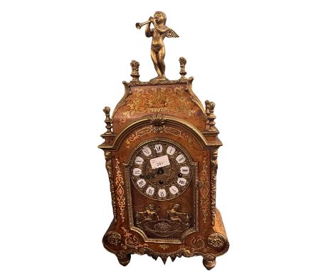 Early 20th Century mantel clock with German chiming movement, the case with faux marquetry decoration with angel musician abo