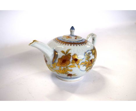 An 18th Century Chinese porcelain teapot and cover with an Imari design (chips to spout, handle and cover)