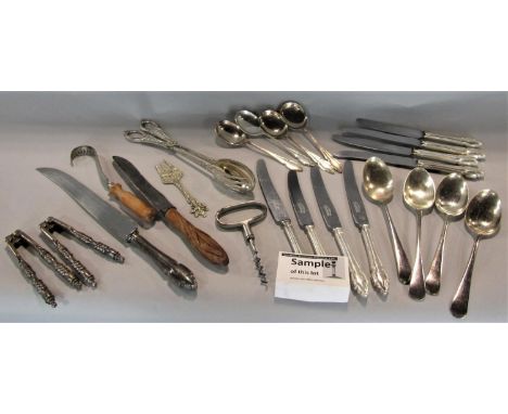 A large collection of silver plated flatware to include a fancy handled set of possibly continental cutlery 