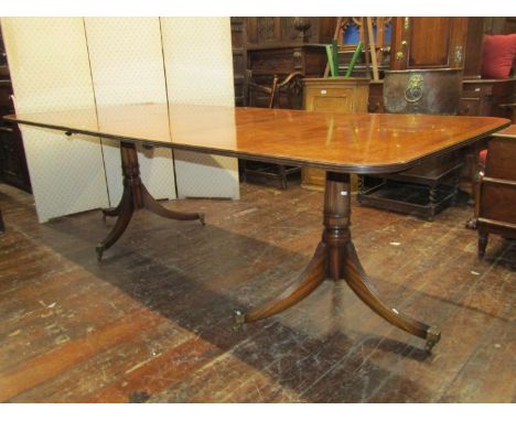 A good quality reproduction Georgian mahogany dining room suite, the table raised on turned pillars and reeded tripod support