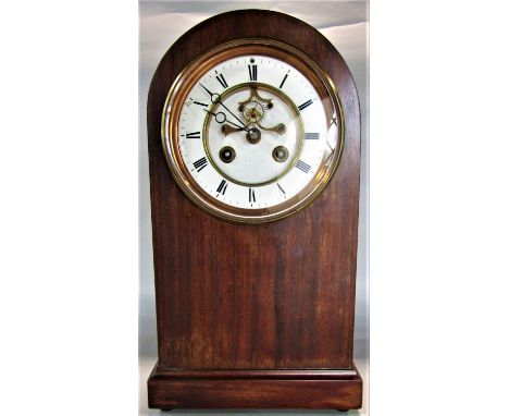 Edwardian fruitwood arched lancet mantle clock, the enamelled dial with further enamelled chapter ring, Roman Numerals and op