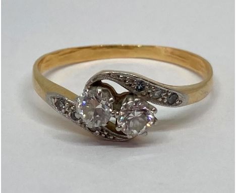 18ct diamond crossover ring, the stones 0.20cts each approx, size R/S, 2.7g 