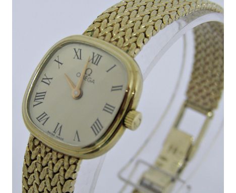 Ladies 9ct Omega quartz dress watch, the coloured dial with Roman numerals and gilt hands, 17mm case, upon an original 9ct wo