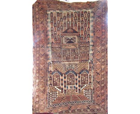 Good antique Turkoman rug with unusual architectural panelled decoration, upon a washed red ground, 170 x 110cm 