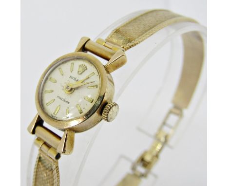 Vintage ladies 9ct Rolex precision cocktail watch, the champagne dial with baton markers, with art deco shaped lugs, 14mm cas