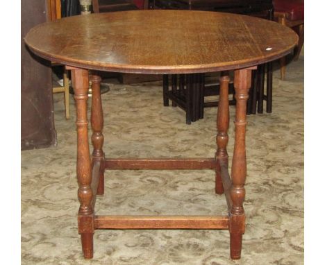 A collection of oak furniture. mainly early 20th century comprising two small gateleg tables on bobbin supports, an open oak 