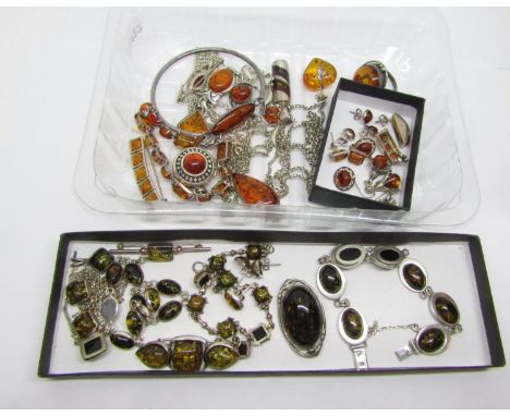 Varied collection of amber and green amber silver jewellery, to include several bracelets, pendants, brooches, earrings, plus