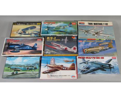 9 model aircraft kits of WW2 fighter planes, all un-started, most with sealed box or sealed contents. Includes kits by Academ