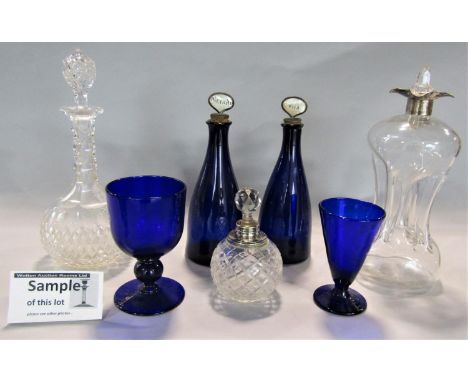 A pair of antique blue glass decanters with cork stoppers and inscribed mother-of-pearl knops for gin and brandy together wit