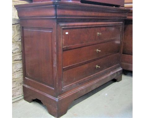 A contemporary chest of three long drawers within a moulded outline set on bracket supports, 120 cm in width, together with a