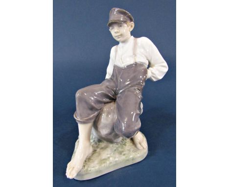 A Royal Copenhagen model of a seated boy, marked to base 1659, 30cm tall approx 