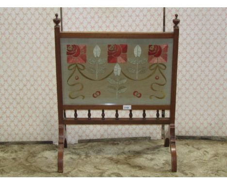 Early 20th century mahogany firescreen, the central panel with art nouveau hand embroidered detail, with further stylised flo
