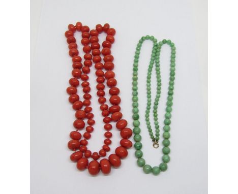 Two graduated bead necklaces; a coral example and a possibly jade example with 9ct clasp (2) 