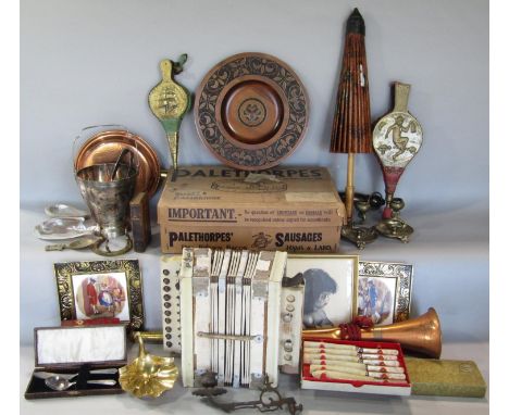 A box of interesting items comprising a small accordion, fire bellows, a Kahsan type rug (af) a silver plated ice bucket, etc