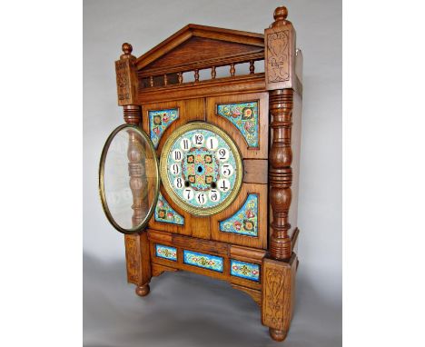 Arts &amp; Crafts oak cased mantle clock fitted with various Iznik type tiles flanked by turned pilasters with further carved