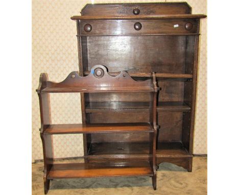 A small Georgian style mahogany occasional table, the oval top on a fluted column and tripod base, a set of open wall shelves