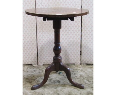 A simple mahogany occasional table, the circular top 53cm diameter, raised on a turned pillar and tripod 