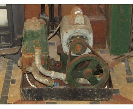 A small vintage Lister engine/pump with electric motor and belt driven fly wheel, number to block 187/1 and applied serial nu