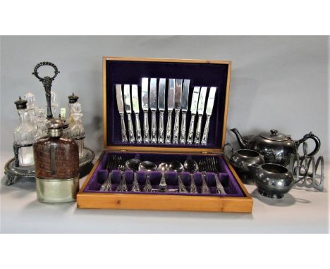 A mixed lot of silver plate comprising a seven glass bottle cruet and stand, lancet toast rack, three piece tea service, silv