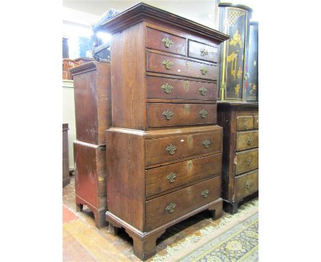 A small Georgian oak countryside chest on chest of six long and two short graduated drawers raised on bracket supports, oak a