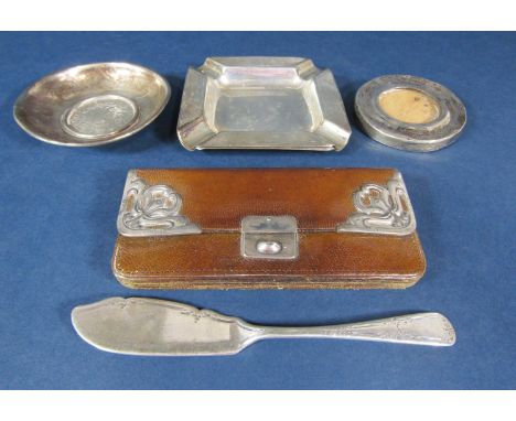 A mixed collection of silver and white metal comprising a pair of engine turned silver ashtrays, a further silver butter knif