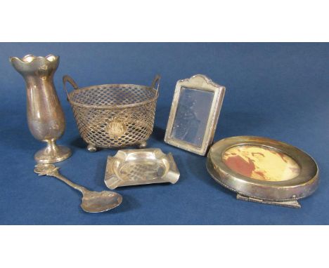 A mixed lot of silver comprising an ashtray, two silver applied easel frames, a small baluster vase, a jubilee spoon and furt