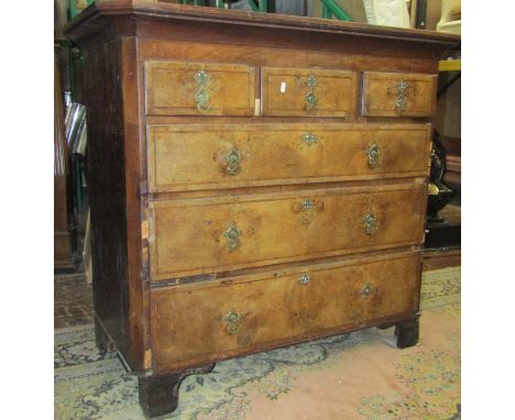 A Georgian walnut and pine countrymade chest of three long and three short drawers, set beneath a pronounced top, with later 