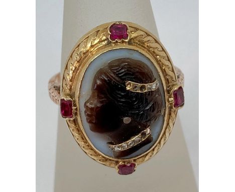 Fine antique blackamoor cameo ring depicting a lady, the agate cameo set with rose cut diamonds and framed by four rubies, in