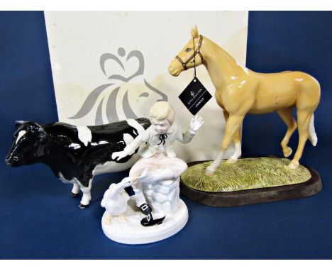 A boxed Royal Doulton model of a palomino pony from the animals series - RDA31, raised on a wooden base, together with a Besw