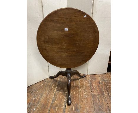 A Georgian mahogany snaptop table, the single piece top 73cm diameter, raised on a single gun barrel pillar, with well presen