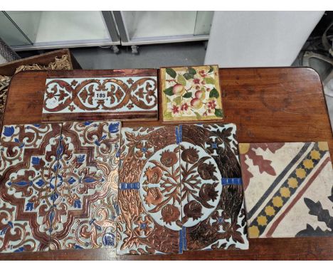 Five Spanish copper lustre decorated tiles, a Victorian tile and an encaustic tile