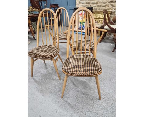 A set of five Ercol high spindle back dining chairs including two armchairs (5)