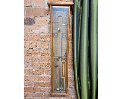 An Admiral Fitzroy barometer and mercury thermometer in a glazed oak case