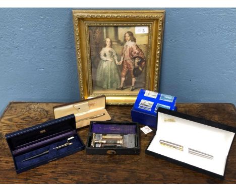Three boxed pens, a vintage wilkinson razor a boxed paperweight and a classical style gilt framed print.