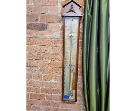An Admiral Fitzroy barometer with a mercury thermometer, the glazed mahogany case with a triangular pediment