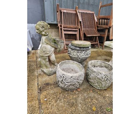 A garden figure of a cherub and an urn form garden planter, together with two other small planters