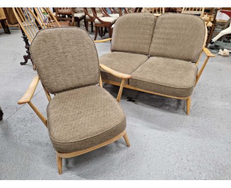 An Ercol double windsor spindle back settee / sofa together with a matching armchair, all with loose cushions