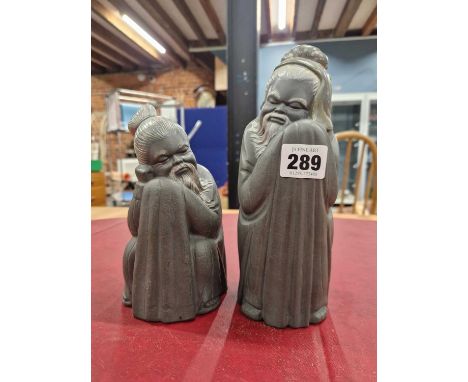 Two Lladro grey porcelain figures of Chinese monks sleeping wrapped in their full length robes, the taller.   H 21cms