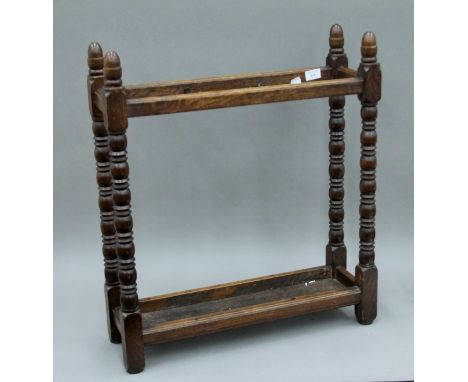 A Victorian oak stick stand. 61 cm wide.