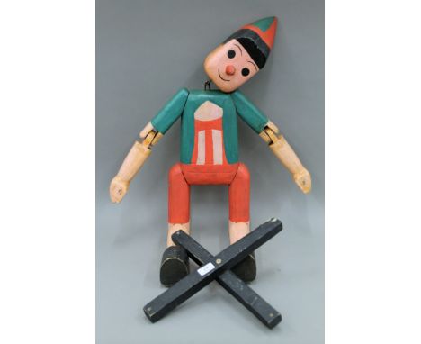 A large wooden Pinocchio puppet. Approximately 90 cm high.