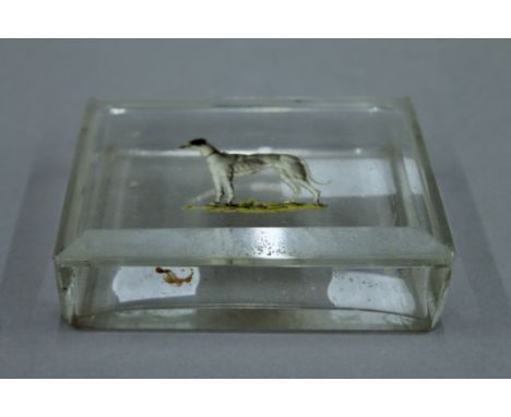A glass trinket box, the lid decorated with a greyhound. 11 cm wide.