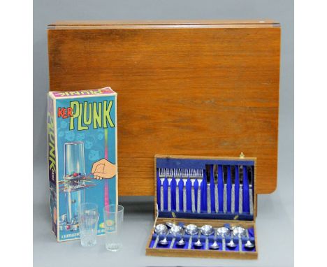 A 20th century drop leaf table, a quantity of glassware, a canteen of cutlery and a vintage Ker Plunk game. The former 83 cm 