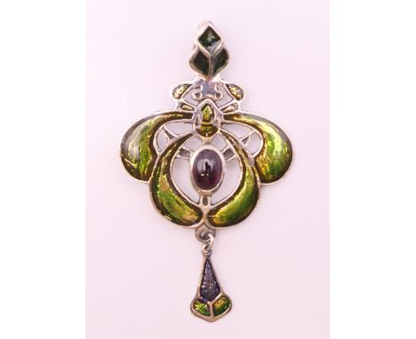 An Art Nouveau style silver pendant.  6 cm high.