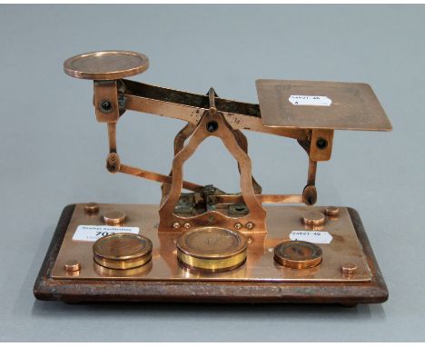 A 19th century set of copper postal scales. 19.5 cm wide.