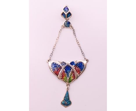 An Art Nouveau style silver pendant.  8 cm high.