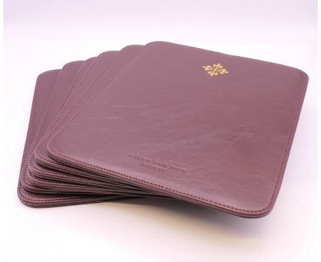 Six Patek Philippe place mats.  