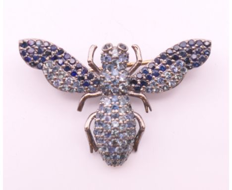A gold backed and silver brooch formed as a bee.  3.5 x 2.25 cm.