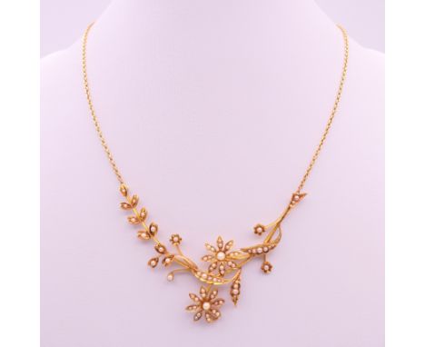 A 15 ct gold and seed pearl set necklace, cased.  Approximately 40 cm long. 11.6 grammes total weight.