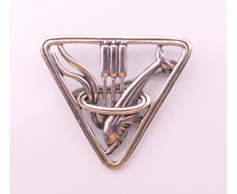A Danish silver dolphin brooch.  3 cm high.